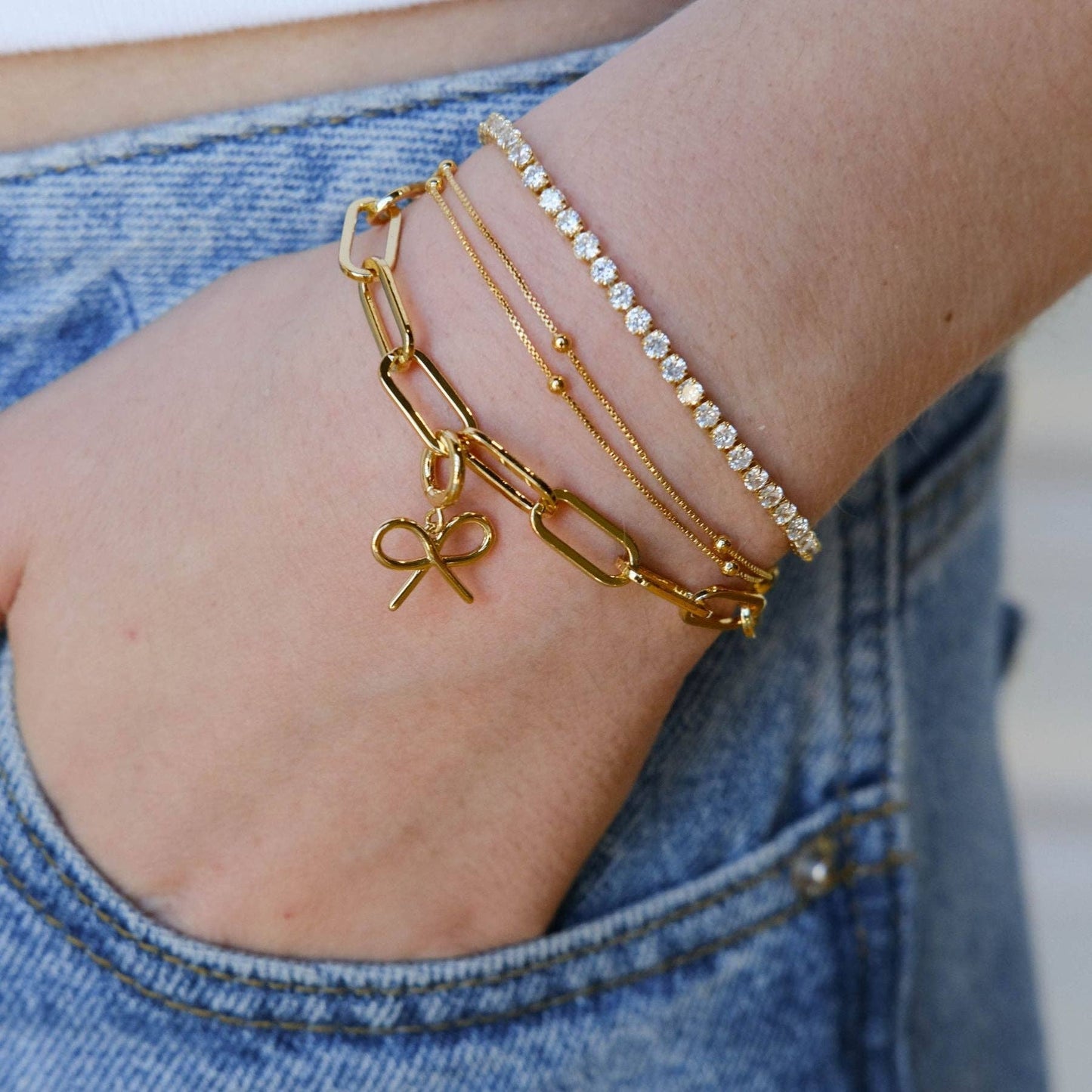 Nickel and Suede - Gold Bow Charm