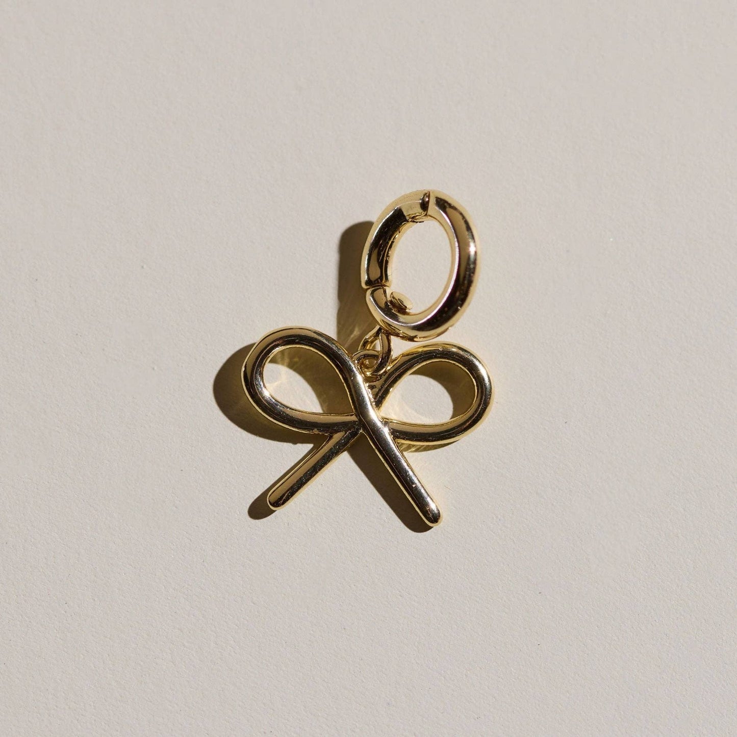 Nickel and Suede - Gold Bow Charm